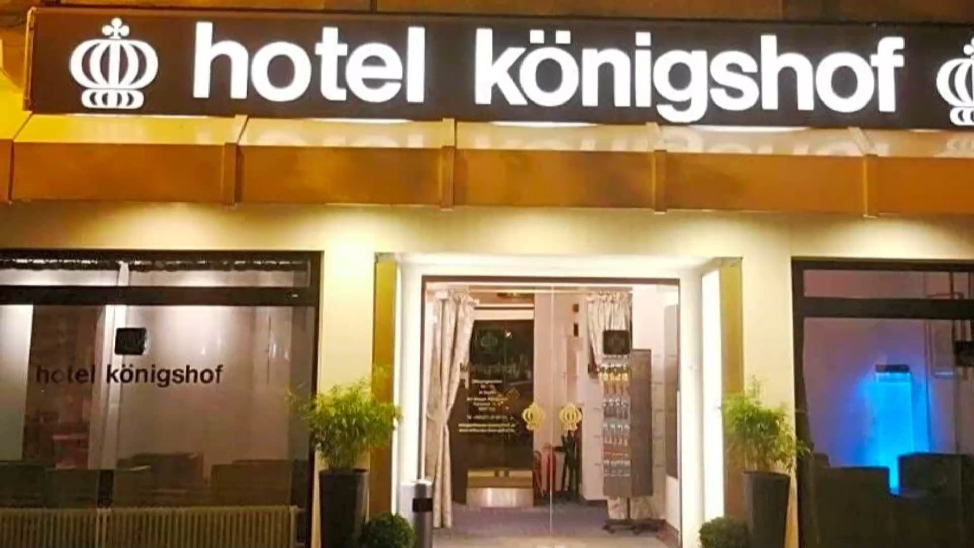 Illuminated hotel entrance at night